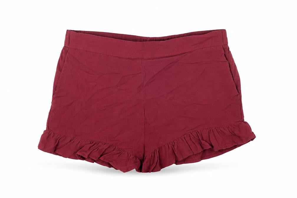 Front view of H&M women’s red viscose hot pants shorts, size UK 10, regular pull on