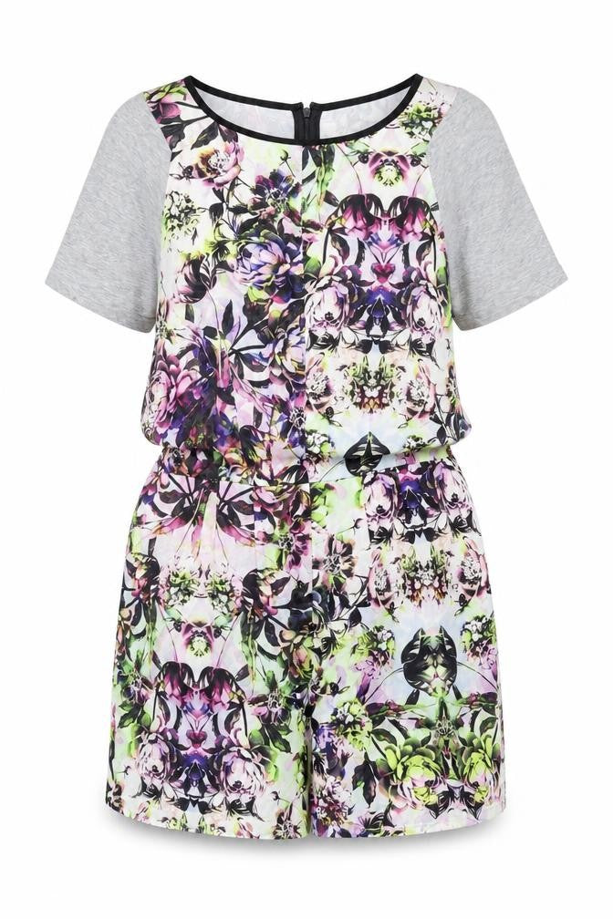 Front view of Warehouse women’s multicoloured floral polyester playsuit one-piece, size UK 12, zip