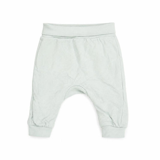 Front view of H&M boys’ blue 100% cotton jogger trousers one size pullover