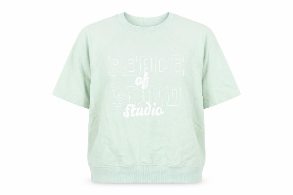 Front view of H&M women’s green cotton pullover sweatshirt, size XS, pullover - peace of mind studio