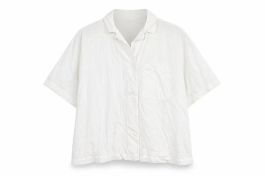 Front view of H&M women’s white viscose basic button-up, size L, collared