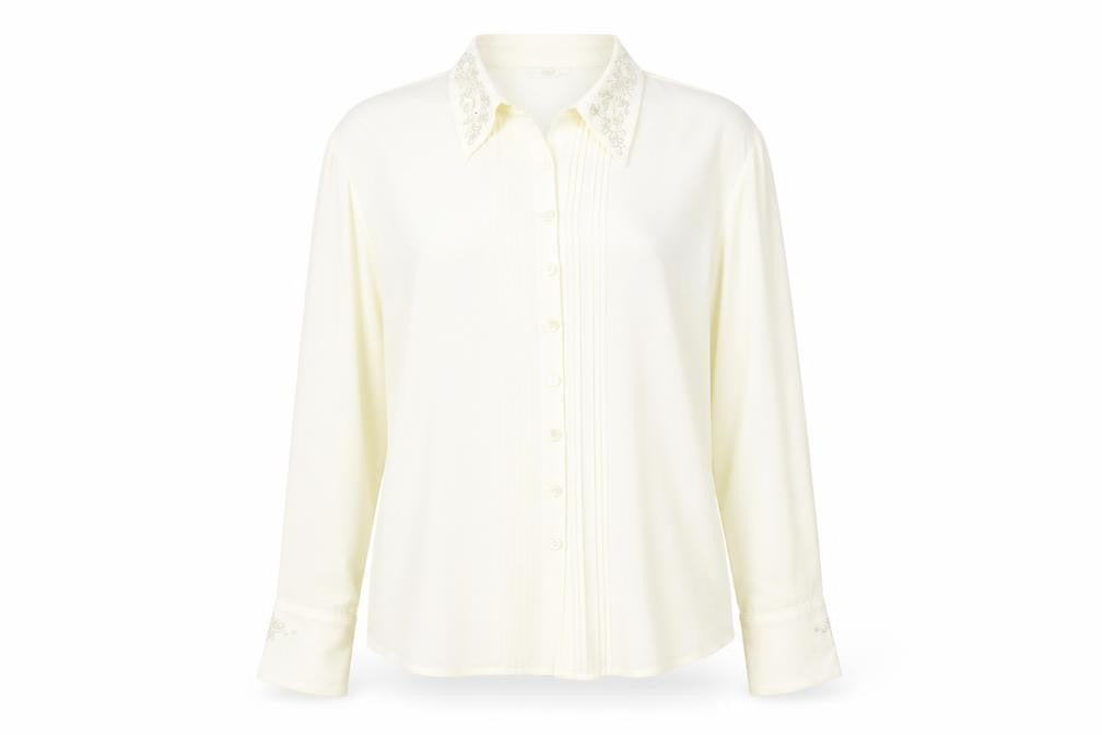 Front view of Marks & Spencer women’s ivory polyester basic button-up, size UK 12, collared