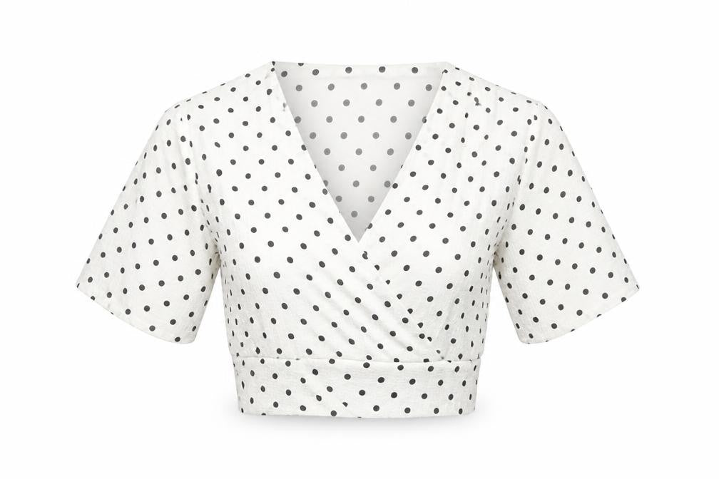 Front view of PRETTYLITTLETHING women’s white polka dot polyester cropped blouse, size UK 6, v-neck