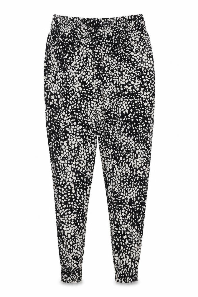 Front view of H&M women’s black geometric viscose harem trousers, size S, regular
