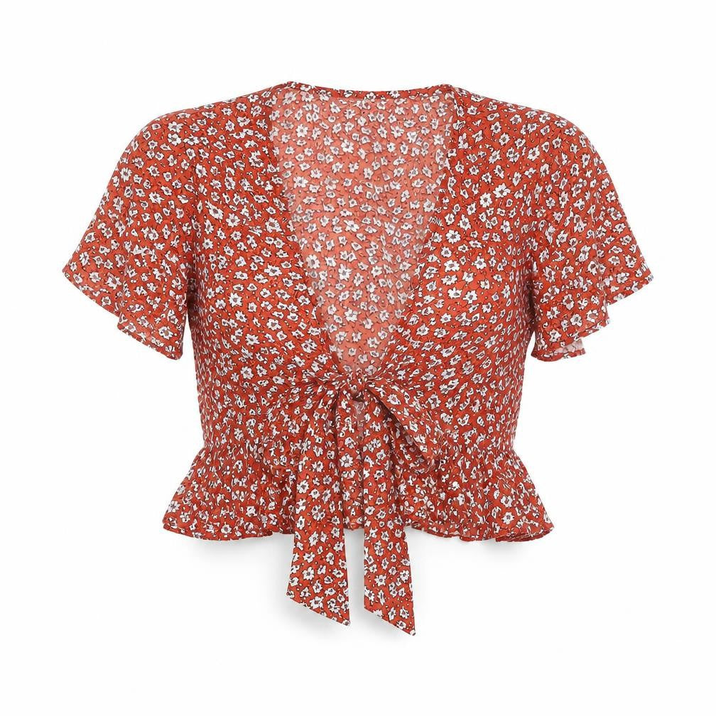 Front view of SHEIN women’s orange floral polyester cropped blouse, size XS, v-neck