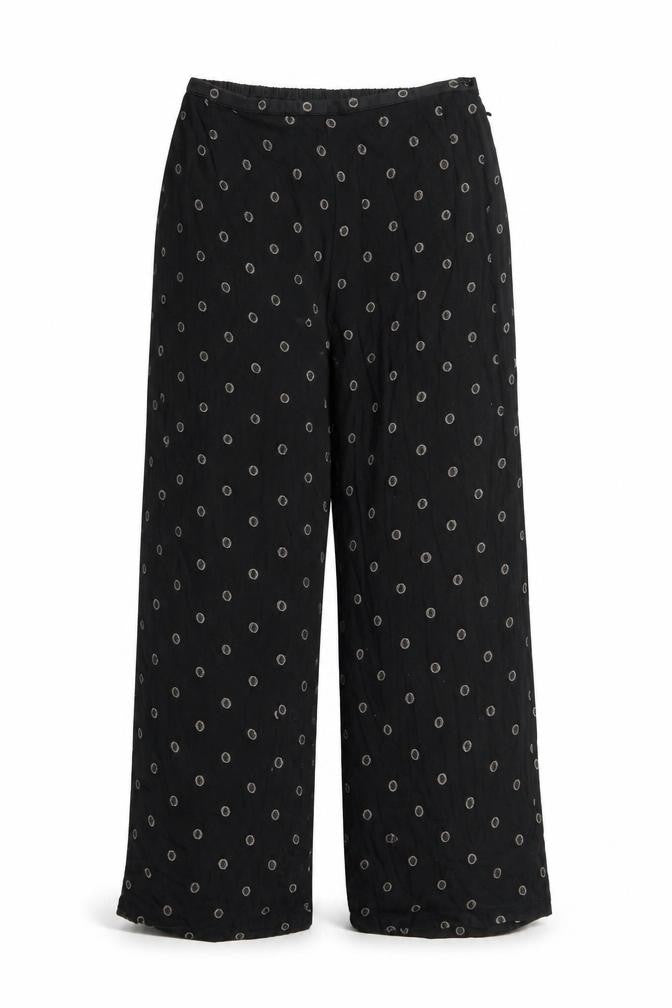 Front view of Preworn women’s black geometric polyester trousers, size UK 30, in regular zip