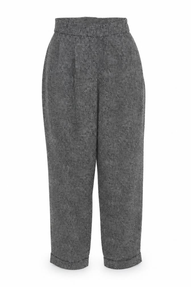 Front view of H&M women’s black geometric polyester trousers, size UK 6, regular