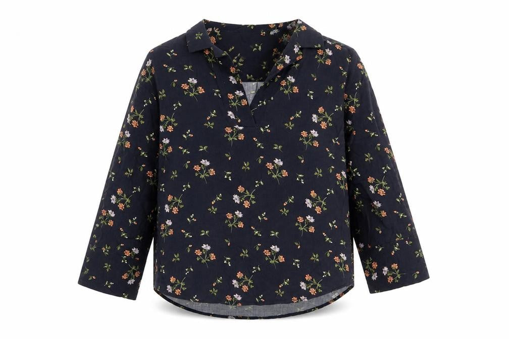 Front view of H&M women’s blue floral viscose basic blouse, size XS, collared