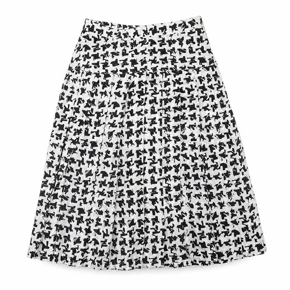 Front view of Tricoville women’s white geometric polyester swing skirt, size UK 12, zip