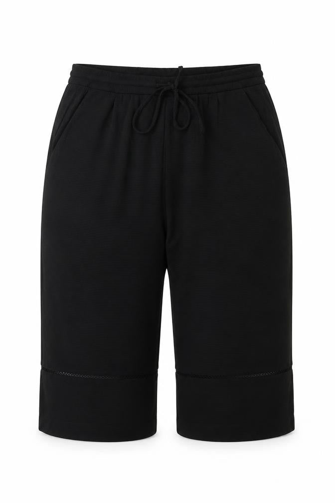 Front view of Zara women’s black polyacrylate fibre cropped trousers, size L, regular drawstring