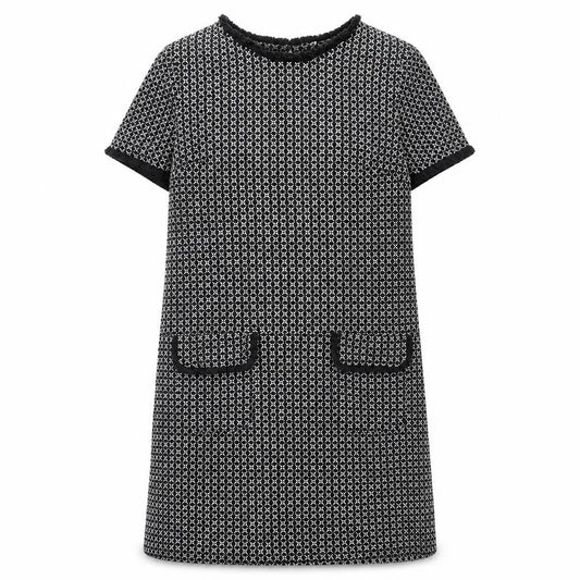 Front view of Quiz women’s black geometric polyester a-line, size UK 12, round neck button