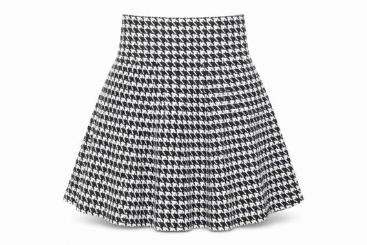Front view of Formula Joven women’s black geometric cotton swing skirt, size UK 8, - houndstooth pattern, size UK 22, waist