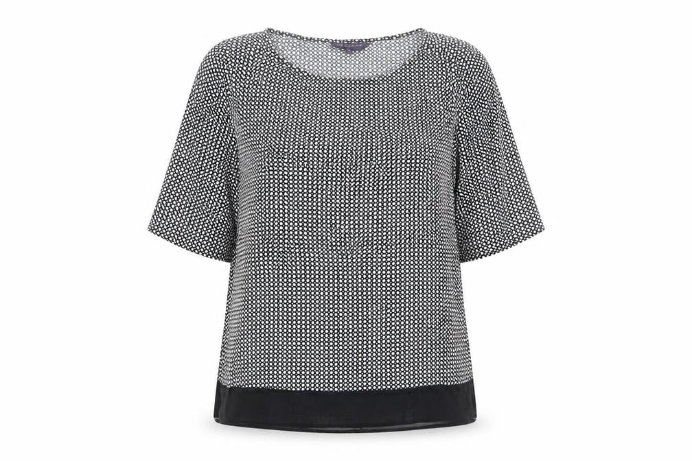 Front view of Marks & Spencer women’s black polka dot viscose basic blouse, size UK 12, round neck