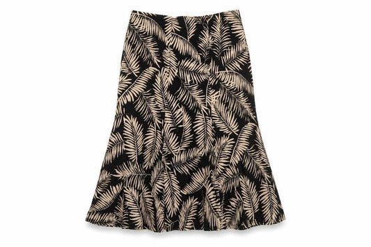 Front view of Country Casuals women’s black geometric polyester swing skirt, size M, - leaf pattern