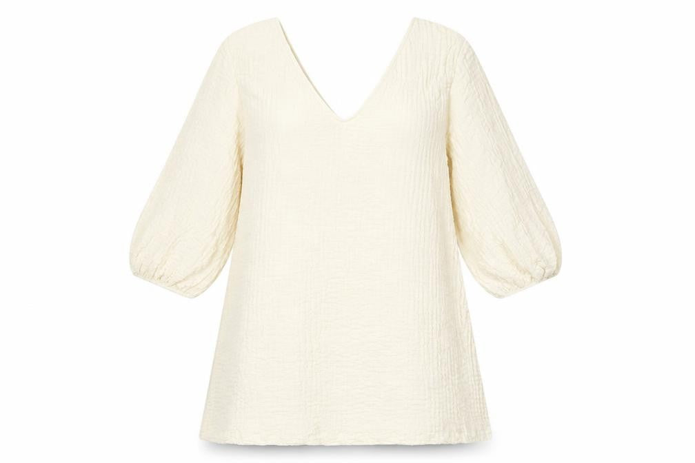 Front view of H&M women’s ivory polyester a-line, size S, v-neck pullover
