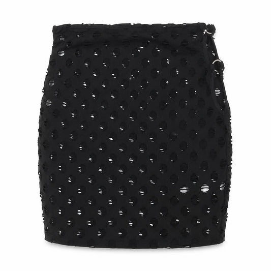 Front view of PRETTYLITTLETHING women’s black polka dot polyester bandage skirt, size UK 8, - cut out side detail