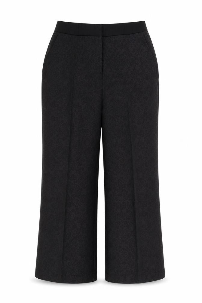 Front view of Next women’s black geometric polyester trousers, size UK 12, regular zip