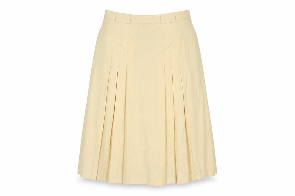 Front view of C&A women’s yellow polyester pleated skirt, size UK 16, zip