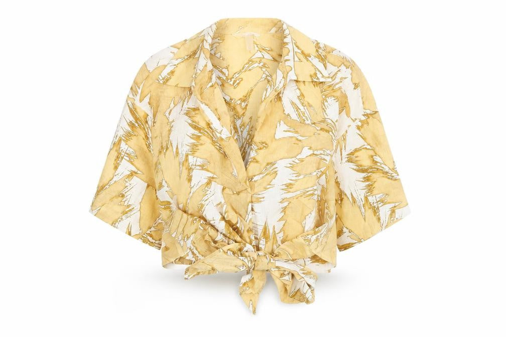 Front view of H&M women’s beige geometric polyester wrap blouse, size XS, collared