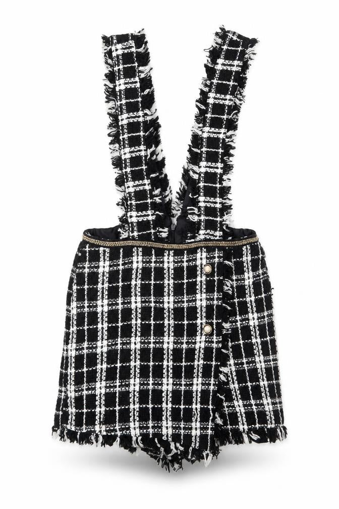 Front view of Rebellious women’s black plaid polyester playsuit one-piece, size UK 10, 3-inch leg zip