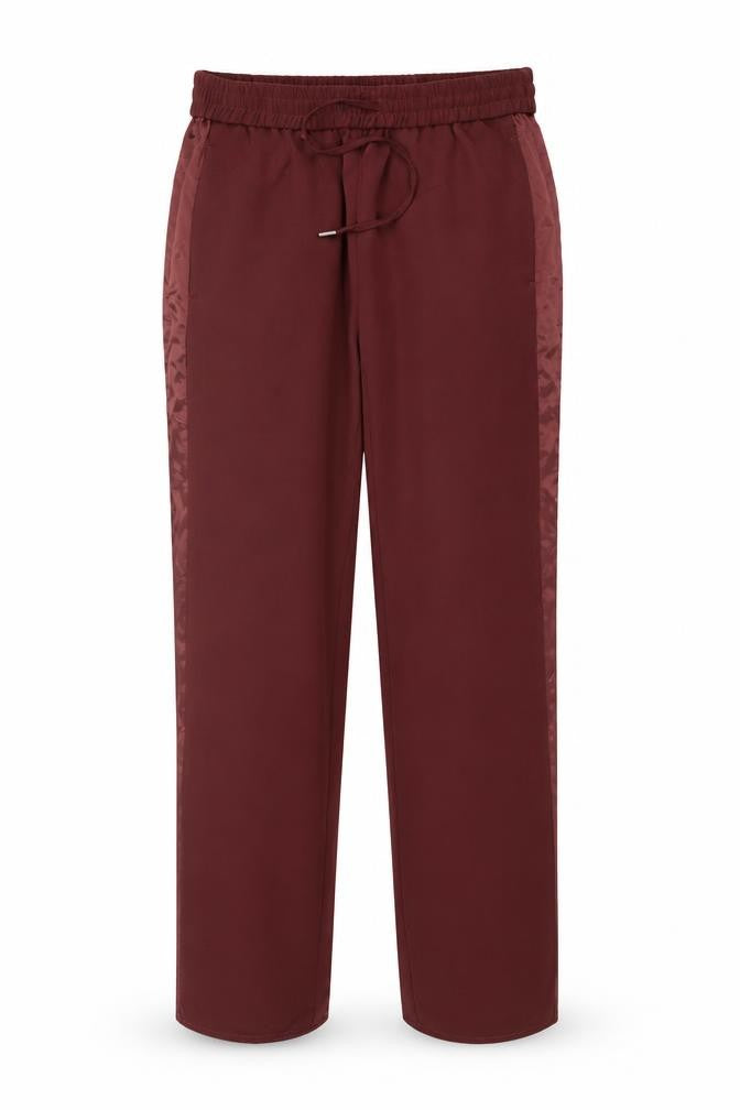 Front view of H&M women’s red polyester trousers, size UK 10, 29-inch leg regular drawstring - taped side