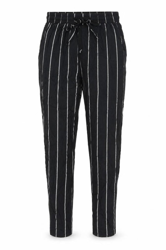 Front view of PRETTYLITTLETHING women’s black striped viscose trousers, size UK 6, 23-inch leg regular drawstring