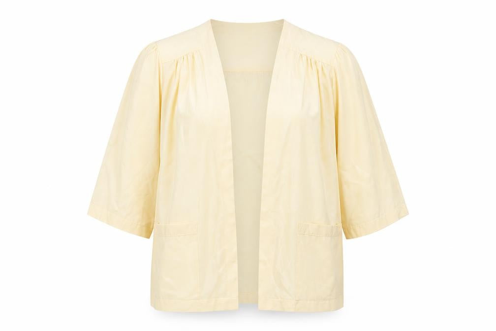 Front view of Sidonie. S women’s yellow v-neck silk cape jumper, size UK 14