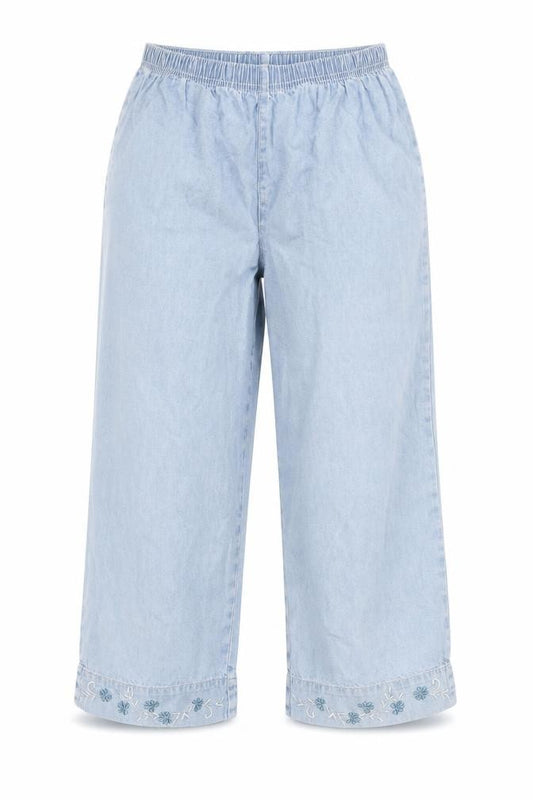 Front view of Woolworths women’s blue cotton capri jeans, size UK 34, in regular - floral embroidery, elastic waist, wide leg