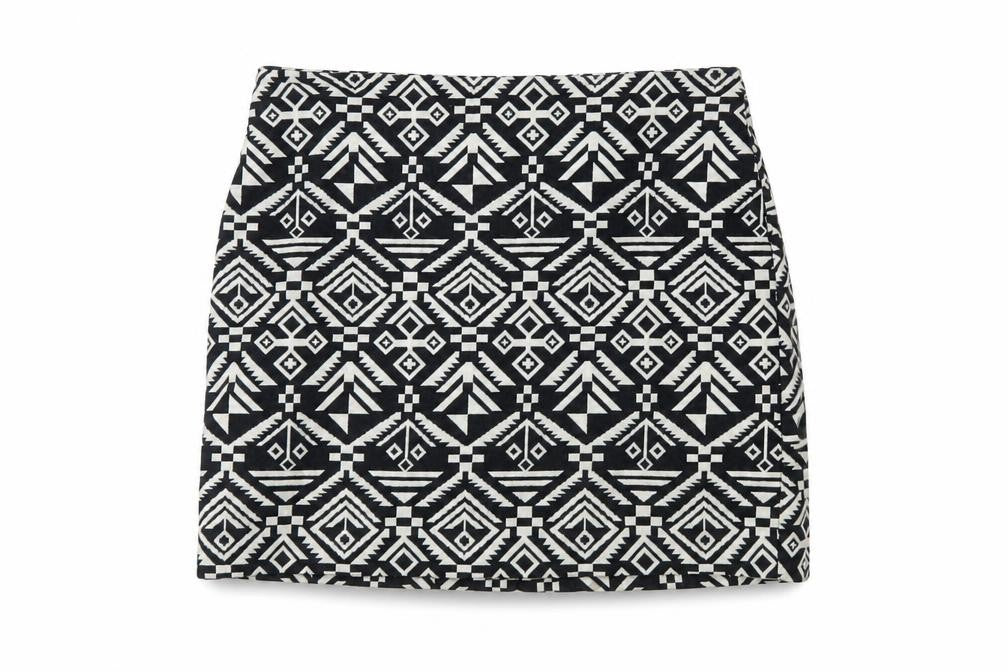 Front view of H&M women’s black geometric cotton mini skirt, size UK 8, zip