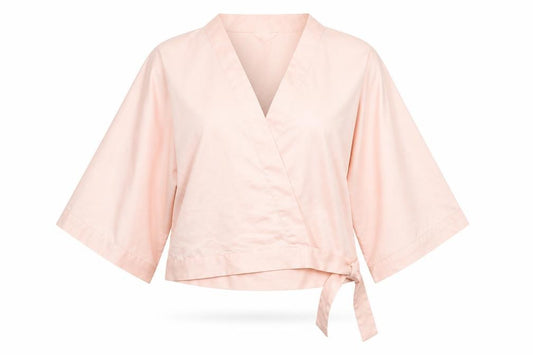 Front view of H&M women’s pink polyester kimono blouse, size M, v-neck