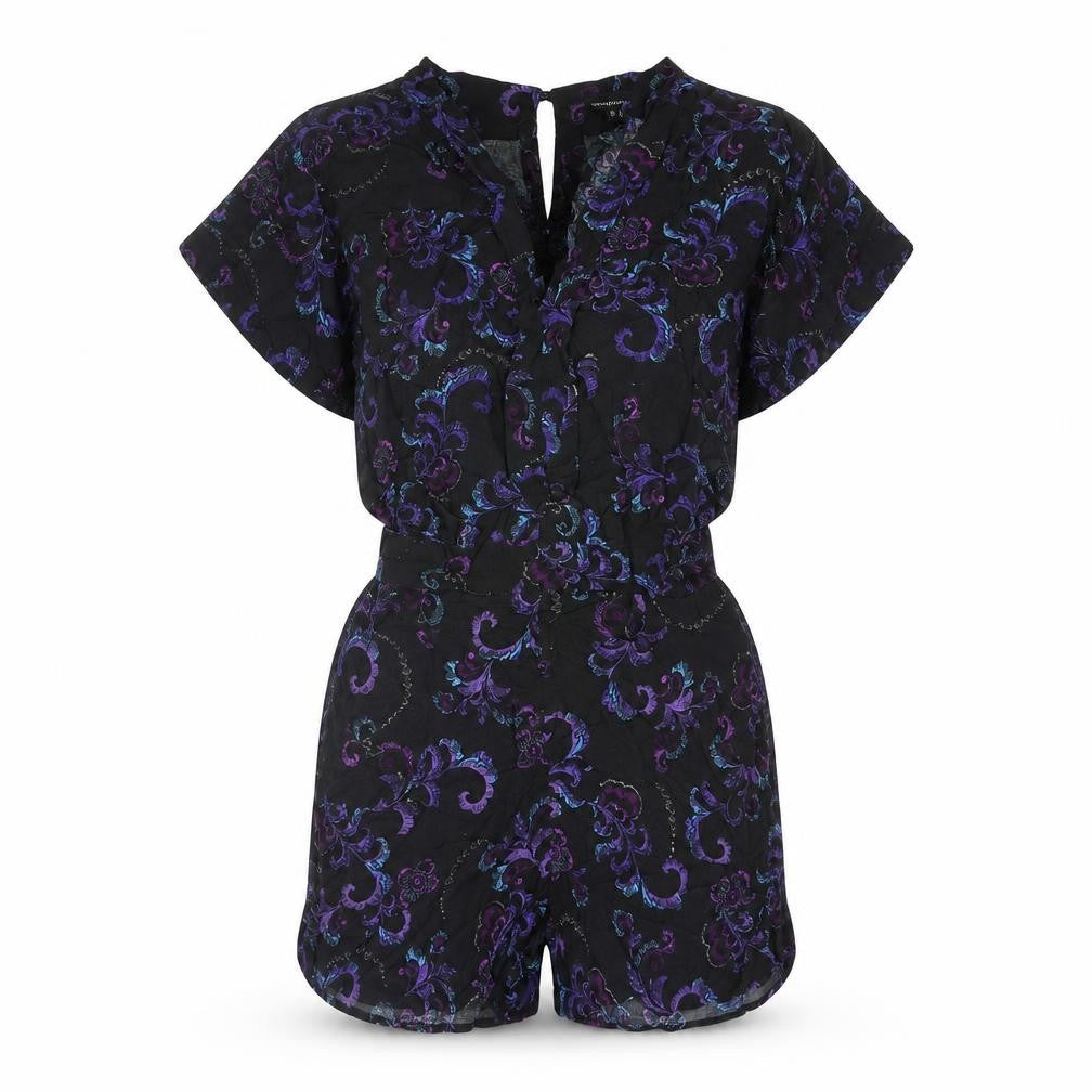 Front view of Warehouse women’s multicoloured geometric viscose playsuit one-piece, size UK 6, 3-inch leg button