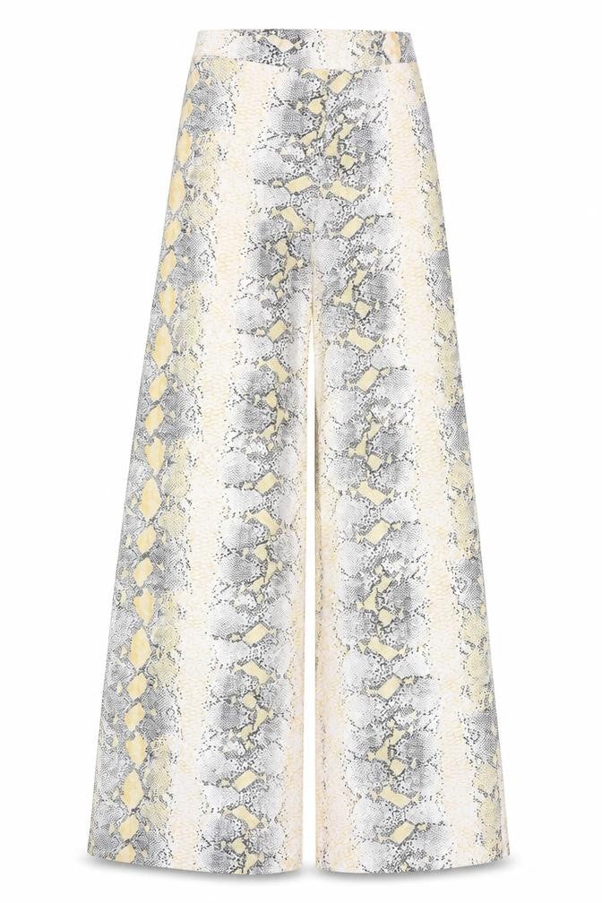 Front view of PRETTYLITTLETHING Women's Yellow Snake Print Trousers