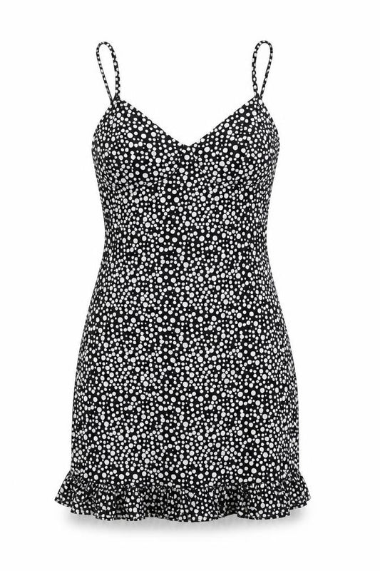 Front view of PRETTYLITTLETHING women’s black polka dot polyester mini, size UK 4, v-neck pullover - ruffle
