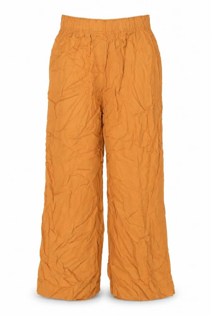 Front view of H&M women’s yellow viscose trousers, size XS, 23-inch leg regular