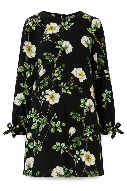Front view of H&M women’s black floral polyester a-line, size UK 6, round neck button