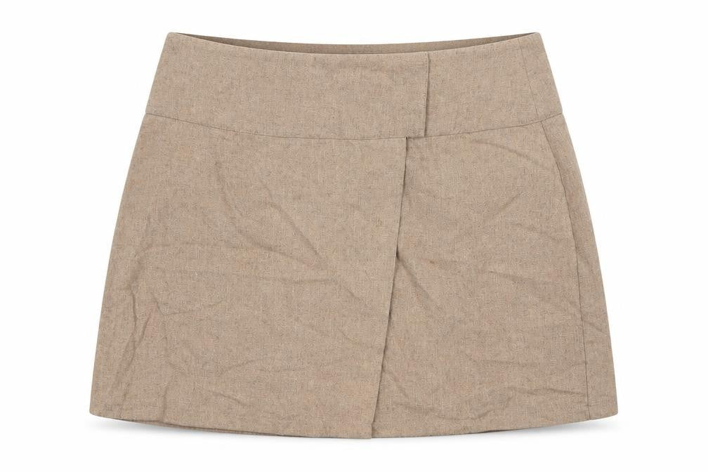 Front view of PRETTYLITTLETHING women’s beige cotton mini skirt, size UK 10, button