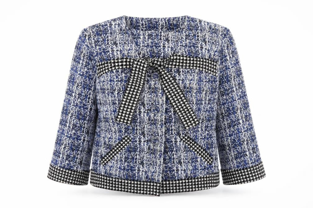 Front view of CAbi women’s blue geometric jacket, size M, button