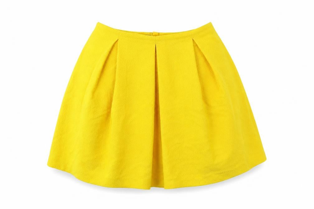 Front view of H&M women’s yellow polyester mini skirt, size UK 6, zip