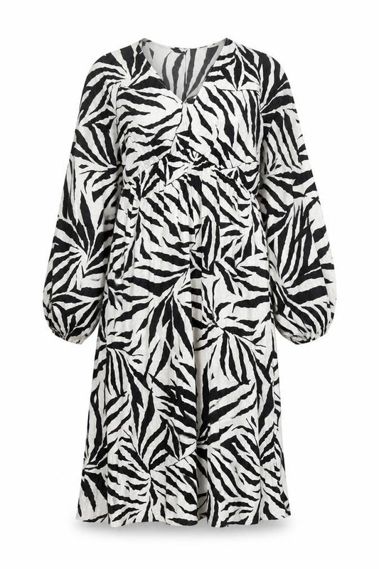 Front view of Marks & Spencer women’s white animal print polyester a-line, size UK 12, v-neck pullover
