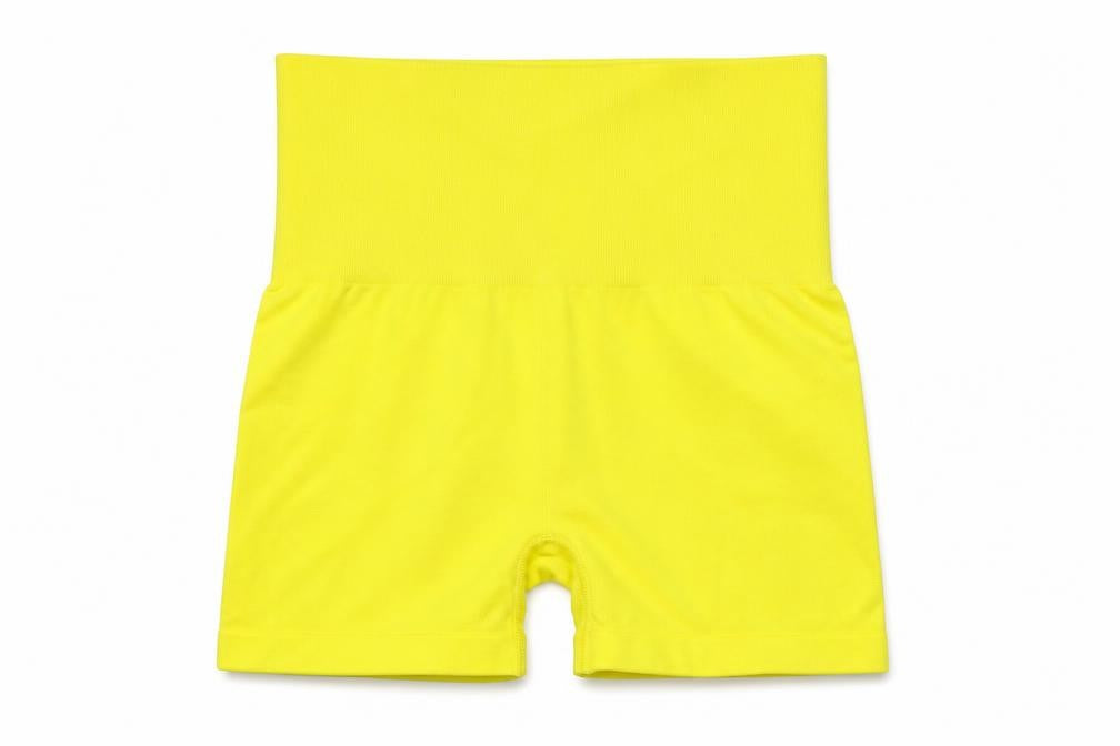 Front view of H&M women’s yellow polyester compression shorts, size S, 4-inch leg slim - high waist
