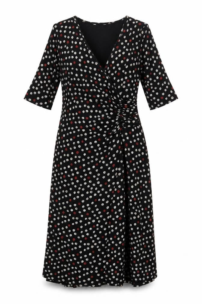 Front view of Marks & Spencer women’s black polka dot viscose a-line, size UK 12, v-neck pullover