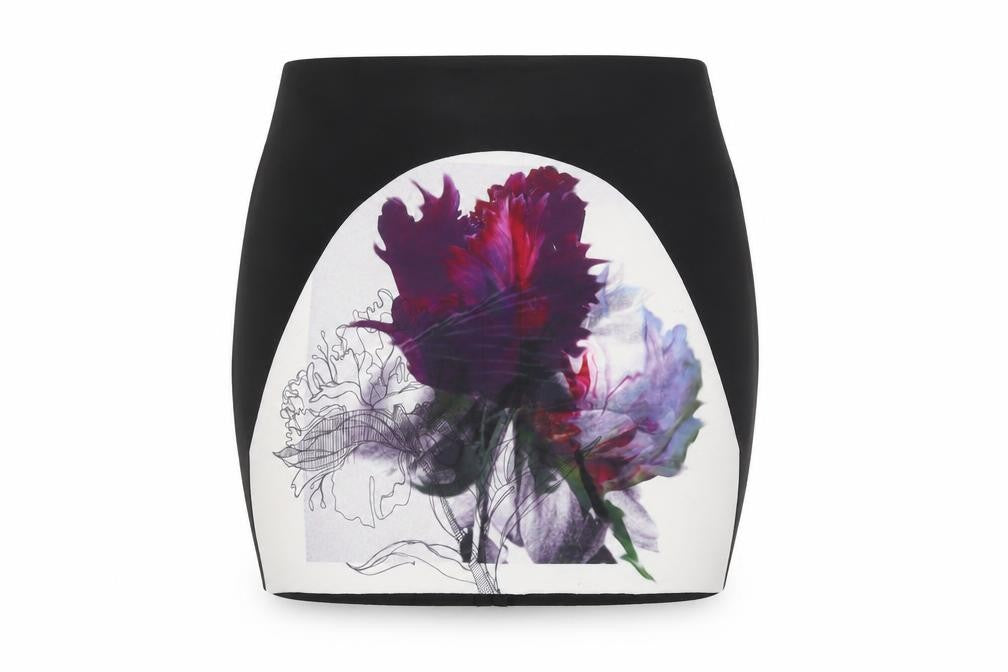 Front view of Missguided women’s black floral polyester mini skirt, size UK 10, zip