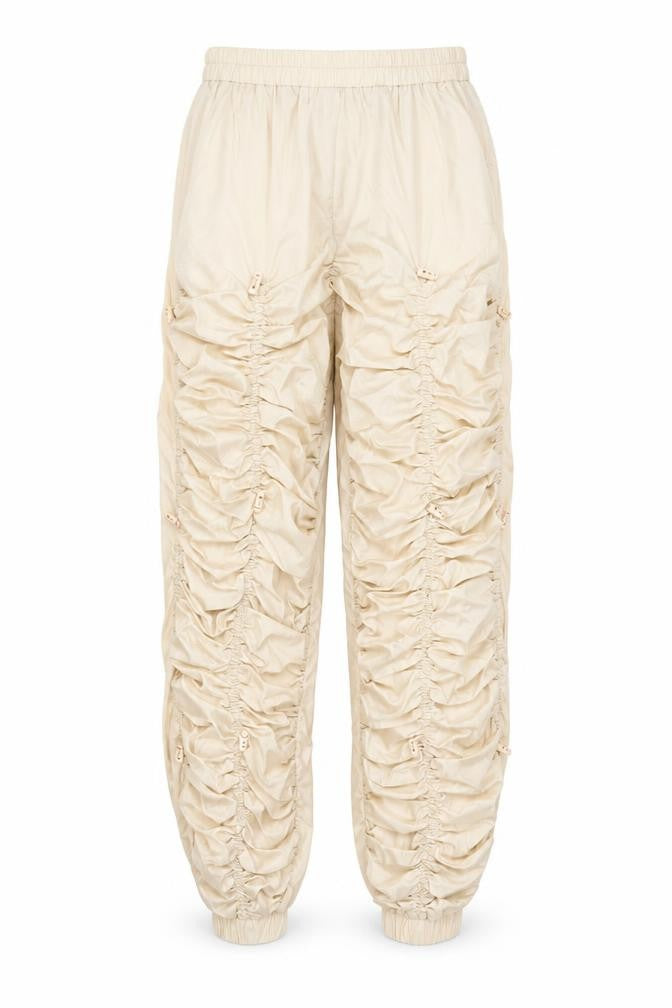 Front view of PRETTYLITTLETHING women’s beige polyester trousers, size UK 12, 27-inch leg regular