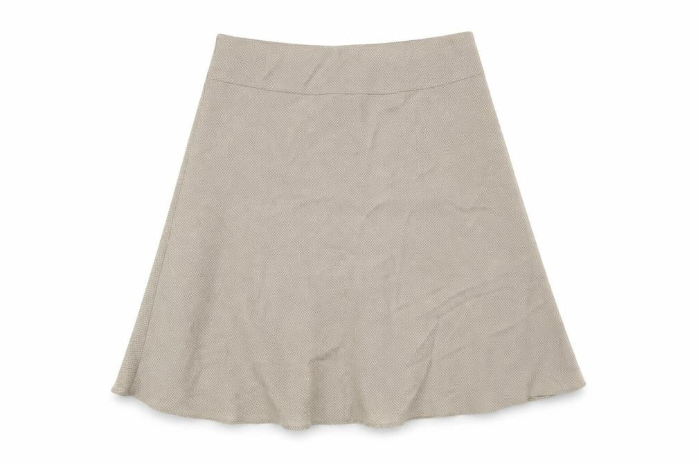 Front view of Marks & Spencer women’s beige polka dot polyester a-line skirt, size UK 14