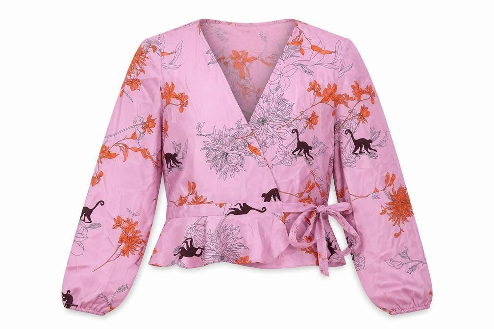 Front view of Topshop women’s pink floral polyester wrap blouse, size UK 8, v-neck