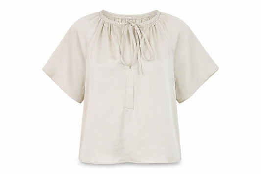 Front view of H&M women’s beige polyester basic blouse, size XS, v-neck