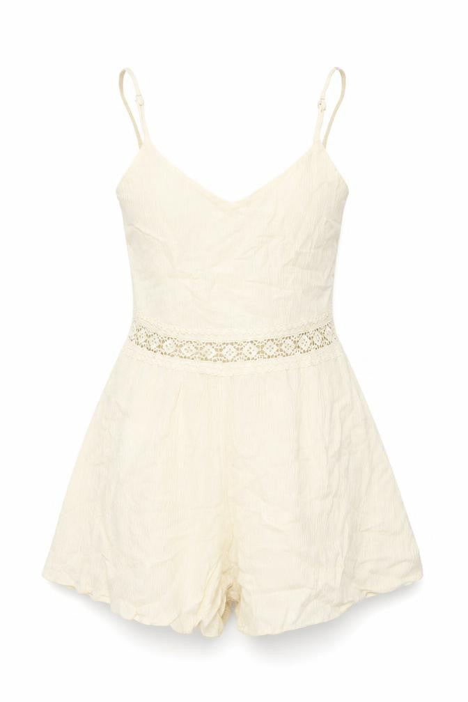 Front view of H&M women’s ivory viscose playsuit one-piece, size UK 6, zip