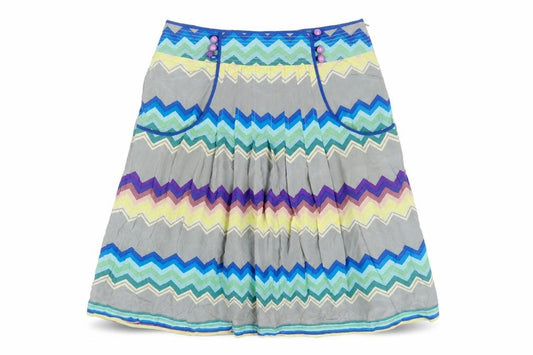 Front view of Plenty women’s multicoloured geometric silk pleated skirt, size UK 32, in zip - button detail