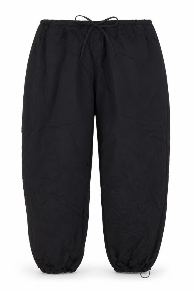 Front view of PRETTYLITTLETHING women’s black polyester trousers, size UK 16, 31-inch leg regular drawstring