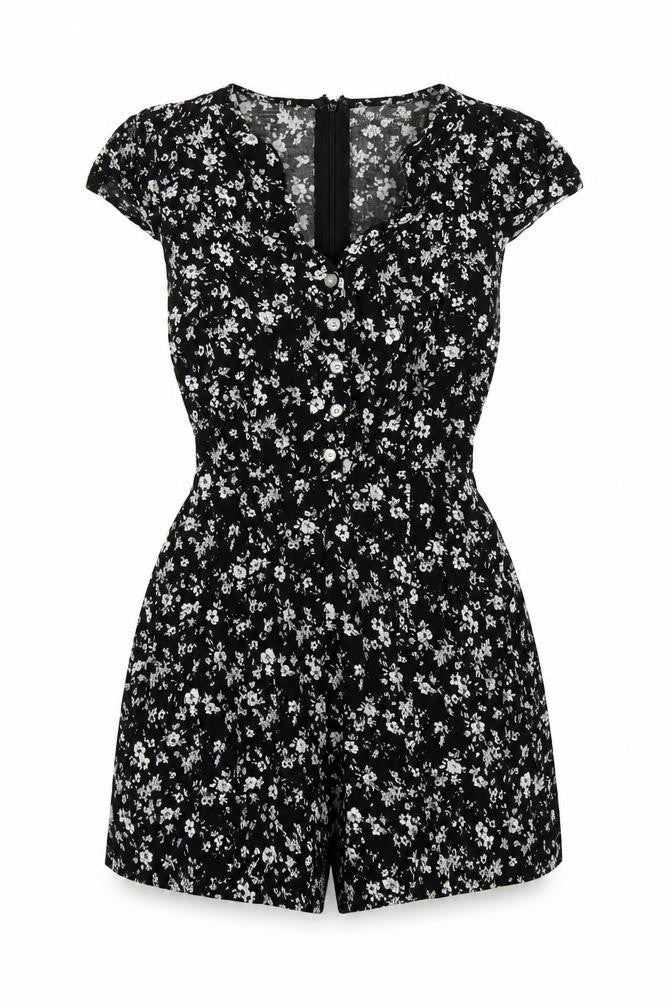 Front view of Louche women’s black geometric viscose playsuit one-piece, size UK 10, zip
